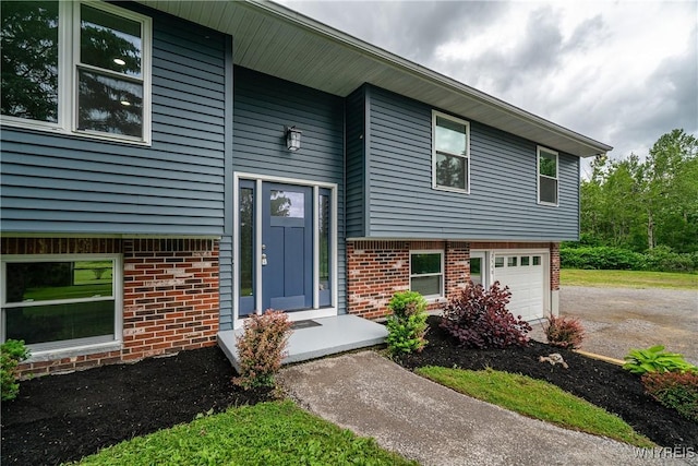 2540 Snyder Rd, Orangeville, NY 14167 - view of front of home featuring brick siding, driveway, and an attached garage