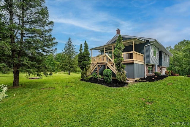2540 Snyder Rd, Orangeville, NY 14167 - rear view of house featuring stairs, a chimney, and a yard