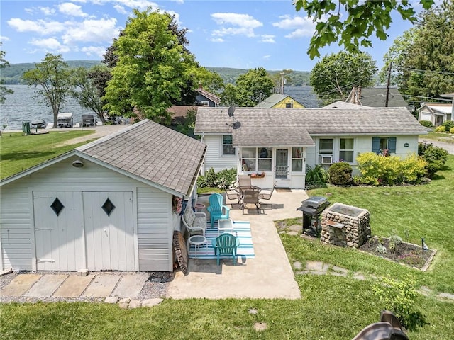8479 Princeton St, Richmond, NY 14471 - rear view of house with a patio, a yard, and roof with shingles
