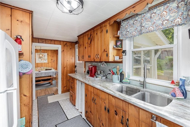 8479 Princeton St, Richmond, NY 14471 - kitchen with freestanding refrigerator, wood walls, brown cabinets, and open shelves