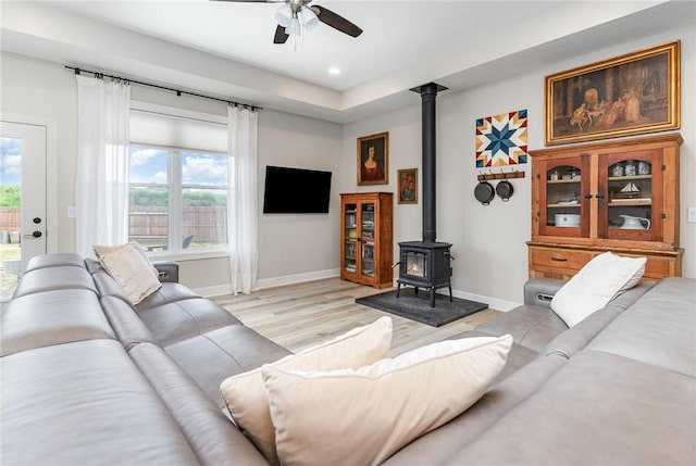 89 Steeplechase, Geneseo, NY 14454 - living area featuring a wood stove, a ceiling fan, light wood-style flooring, and recessed lighting