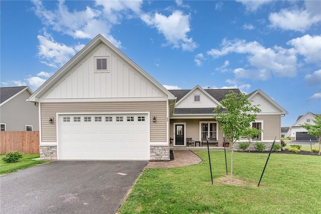 89 Steeplechase, Geneseo, NY 14454 - view of front of home with board and batten siding, driveway, stone siding, an attached garage, and a porch