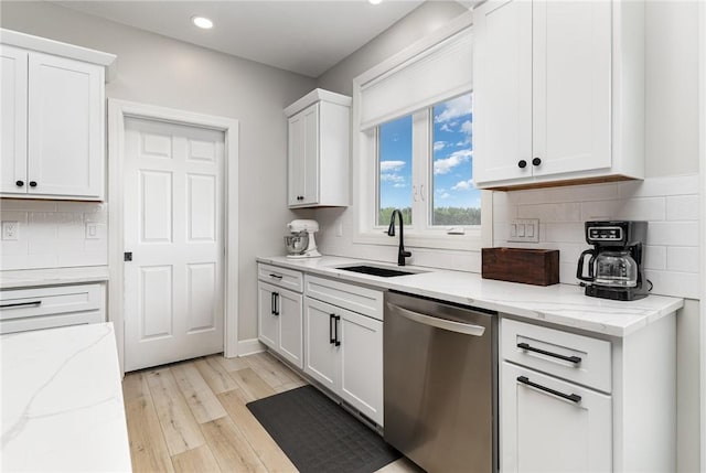 89 Steeplechase, Geneseo, NY 14454 - kitchen featuring dishwasher, light wood-style flooring, white cabinetry, backsplash, and recessed lighting