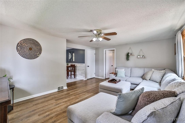 37 Rosary Blvd, Cheektowaga, NY 14225 - living area with wood finished floors, a ceiling fan, and a textured ceiling