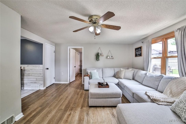 37 Rosary Blvd, Cheektowaga, NY 14225 - living room with a textured ceiling, a ceiling fan, and wood finished floors