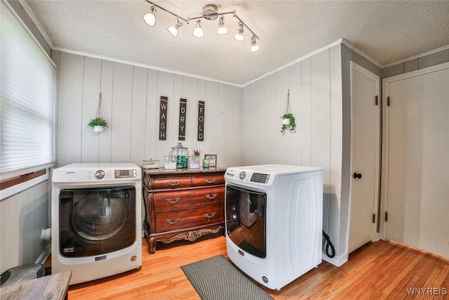 37 Rosary Blvd, Cheektowaga, NY 14225 - washroom with light wood-style floors, ornamental molding, a textured ceiling, and washing machine and dryer