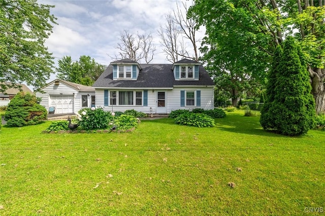 703 Winchester Rd, Dewitt, NY 13057 - cape cod home featuring a front yard, an attached garage, and an outdoor structure