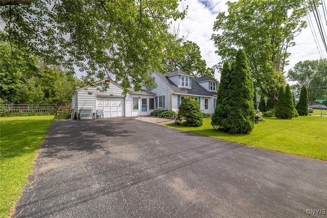 703 Winchester Rd, Dewitt, NY 13057 - cape cod home with asphalt driveway and a garage