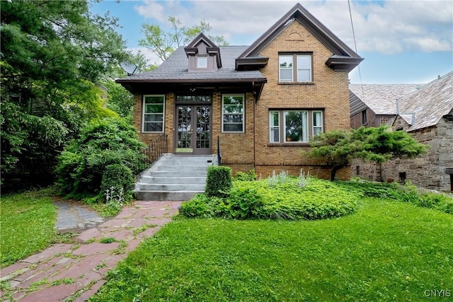 151 Edgehill Rd, Syracuse, NY 13224 - view of front facade with french doors, brick siding, and a front lawn