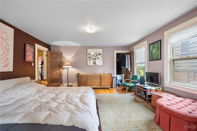 151 Edgehill Rd, Syracuse, NY 13224 - bedroom featuring light wood-type flooring and a walk in closet