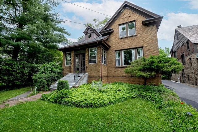 151 Edgehill Rd, Syracuse, NY 13224 - view of front facade with brick siding and a front yard