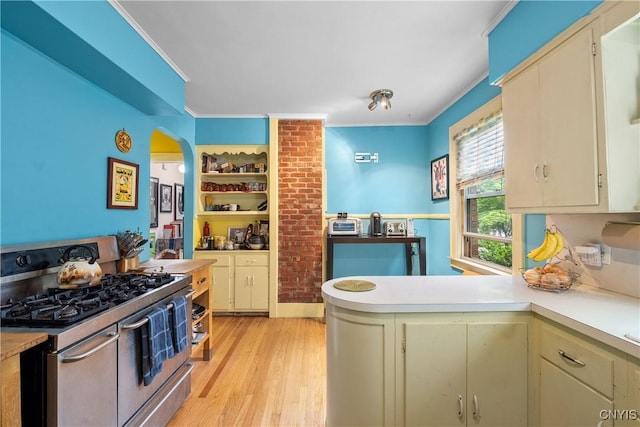 151 Edgehill Rd, Syracuse, NY 13224 - kitchen featuring double oven range, light countertops, cream cabinets, light wood-style flooring, and crown molding