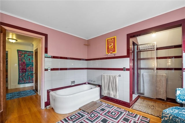 151 Edgehill Rd, Syracuse, NY 13224 - full bath with wood finished floors, tile walls, a garden tub, crown molding, and a shower stall