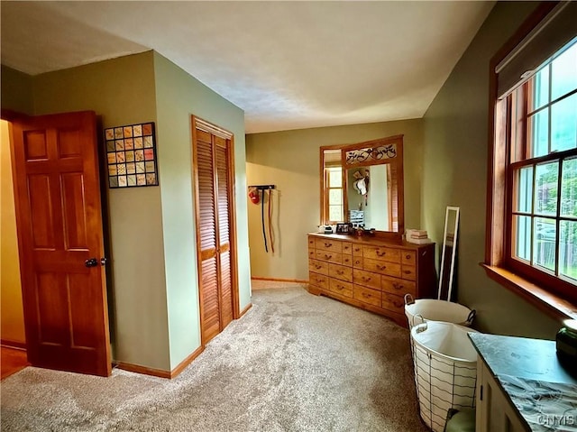 550 Sayles St, Oneida-Inside, NY 13421 - bedroom featuring multiple windows, carpet flooring, and a closet