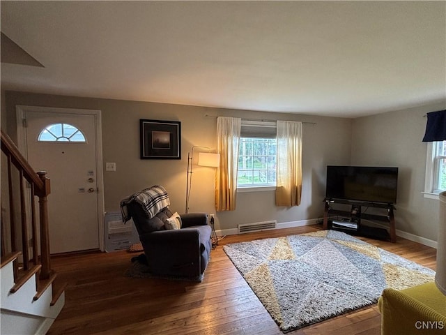 301 Loma Ave, Syracuse, NY 13208 - living room featuring stairs, plenty of natural light, and wood-type flooring