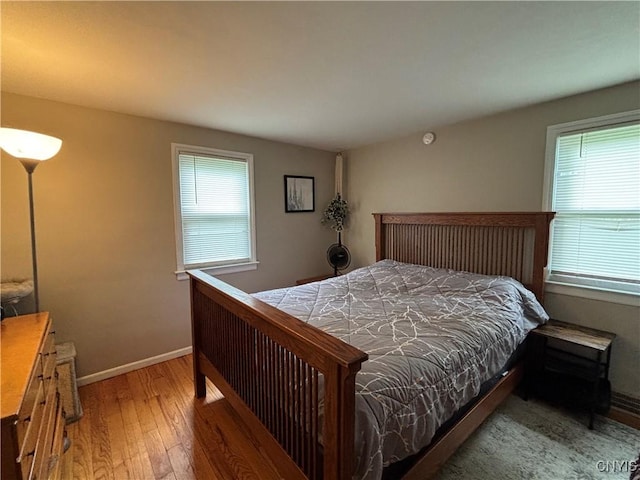 301 Loma Ave, Syracuse, NY 13208 - bedroom with wood-type flooring and baseboards