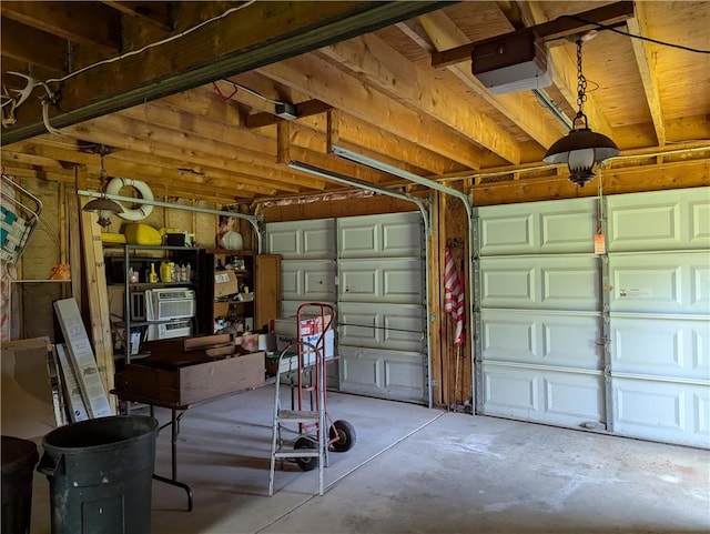 12941 Hillcrest Dr, Carlton, NY 14411 - garage featuring a garage door opener