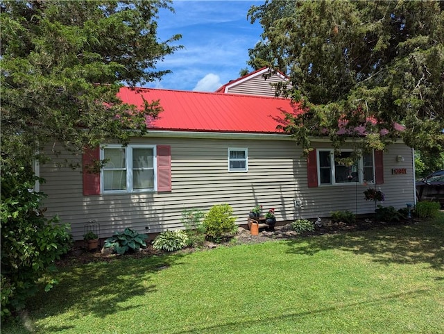 12941 Hillcrest Dr, Carlton, NY 14411 - view of side of property featuring a metal roof and a yard