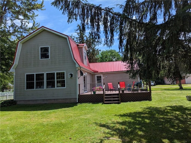 12941 Hillcrest Dr, Carlton, NY 14411 - back of house featuring a deck, a lawn, and a metal roof