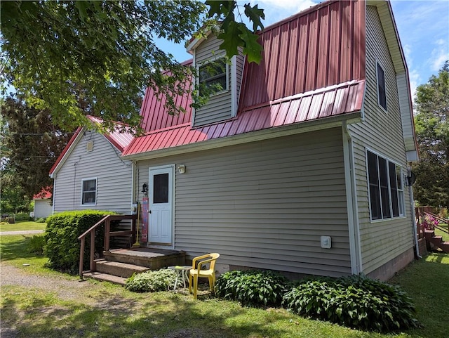 12941 Hillcrest Dr, Carlton, NY 14411 - rear view of house featuring a metal roof and a gambrel roof