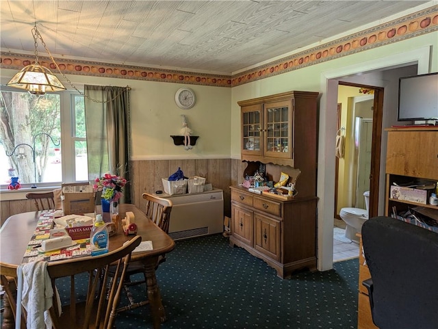 12941 Hillcrest Dr, Carlton, NY 14411 - carpeted dining area with wainscoting and wooden walls