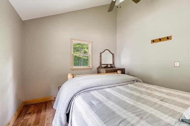 146 Mohawk Dr W, Webb, NY 13420 - bedroom with wood finished floors, a ceiling fan, and high vaulted ceiling