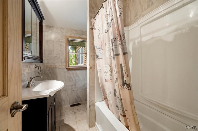 146 Mohawk Dr W, Webb, NY 13420 - full bathroom featuring vanity, shower / tub combo, tile walls, and tile patterned flooring