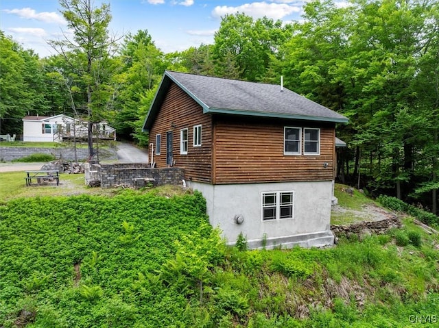 146 Mohawk Dr W, Webb, NY 13420 - view of home's exterior with a view of trees