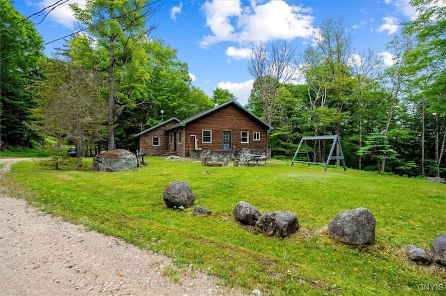 146 Mohawk Dr W, Webb, NY 13420 - view of home's exterior with a yard