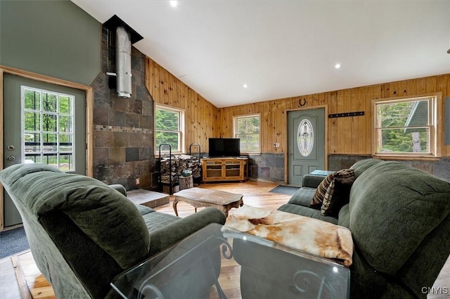 146 Mohawk Dr W, Webb, NY 13420 - living room with lofted ceiling and wooden walls