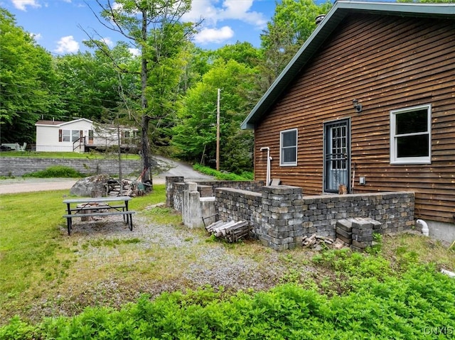146 Mohawk Dr W, Webb, NY 13420 - view of side of property featuring a lawn