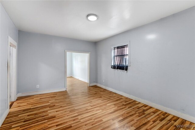 86 Deshler St, Buffalo, NY 14212 - unfurnished room with wood finished floors and baseboards