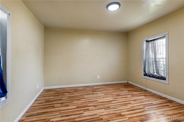 86 Deshler St, Buffalo, NY 14212 - spare room with wood finished floors and baseboards