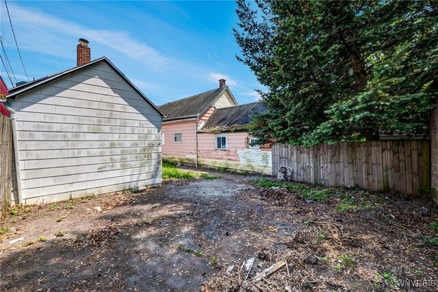86 Deshler St, Buffalo, NY 14212 - back of house with a chimney