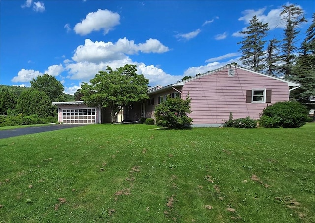 34 Crestview Dr W, Southport, NY 14871 - view of front of home with driveway, an attached garage, and a front lawn