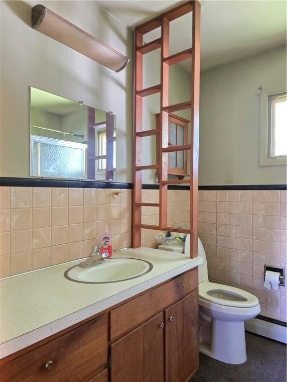 34 Crestview Dr W, Southport, NY 14871 - bathroom featuring tile walls, a baseboard heating unit, vanity, a stall shower, and backsplash