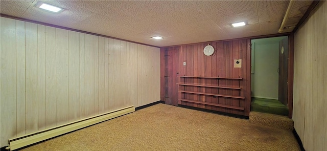 34 Crestview Dr W, Southport, NY 14871 - finished basement featuring a baseboard radiator, carpet flooring, and wooden walls