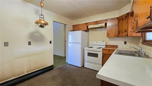 34 Crestview Dr W, Southport, NY 14871 - kitchen with white appliances, under cabinet range hood, brown cabinetry, light countertops, and hanging light fixtures