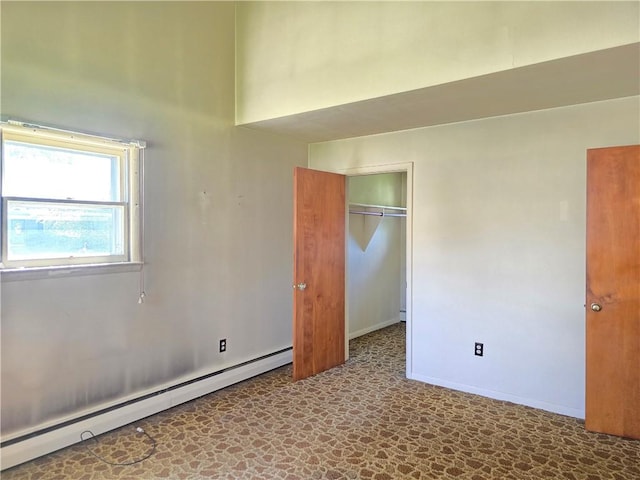 34 Crestview Dr W, Southport, NY 14871 - unfurnished bedroom with a baseboard heating unit, a closet, and tile patterned floors
