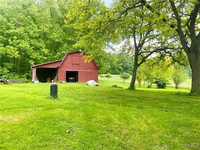 11671 Gowanda State Rd, North Collins, NY 14111 - view of grassy yard featuring a garage, an outdoor structure, and a barn