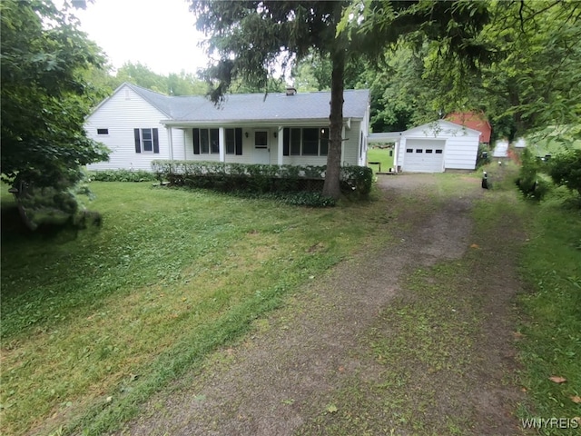 11671 Gowanda State Rd, North Collins, NY 14111 - single story home with an outdoor structure, dirt driveway, a front lawn, a porch, and a detached garage
