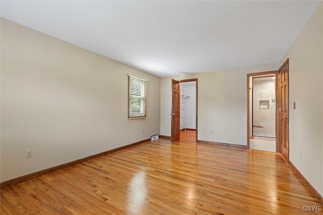 8013 Ginger Rd, Clay, NY 13090 - unfurnished room featuring light wood-style flooring and baseboards