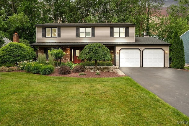 8013 Ginger Rd, Clay, NY 13090 - view of front facade with driveway, a front lawn, view of wooded area, and a garage