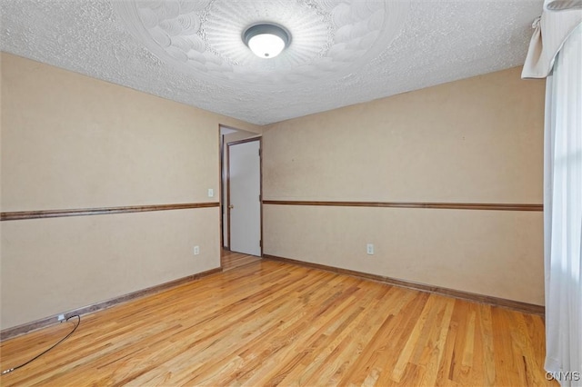 8013 Ginger Rd, Clay, NY 13090 - unfurnished room featuring wood finished floors and a textured ceiling