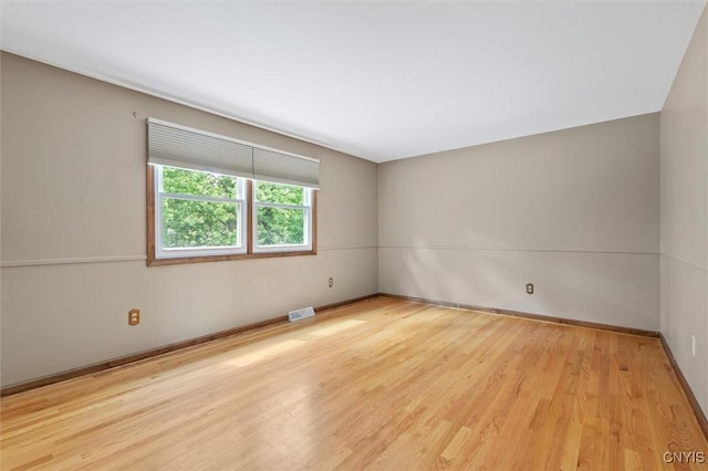 8013 Ginger Rd, Clay, NY 13090 - spare room with wood finished floors and baseboards