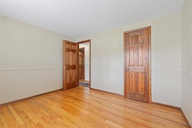 8013 Ginger Rd, Clay, NY 13090 - unfurnished bedroom with light wood-style floors and baseboards