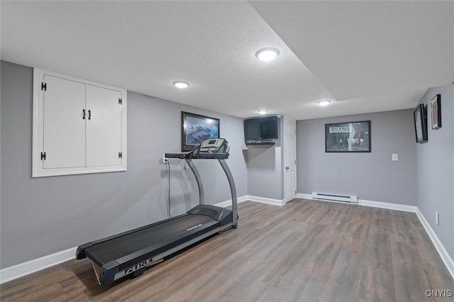 8013 Ginger Rd, Clay, NY 13090 - workout room featuring a baseboard heating unit, wood finished floors, recessed lighting, and a textured ceiling