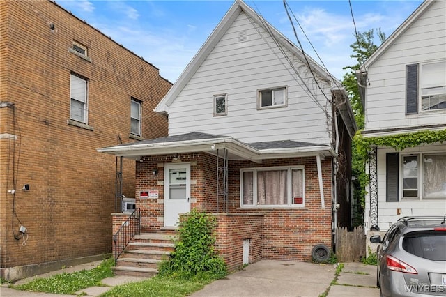 1004 19th St, Niagara Falls, NY 14301 - view of front of house featuring brick siding and roof with shingles