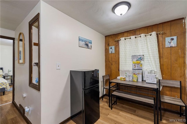 1004 19th St, Niagara Falls, NY 14301 - dining space with light wood-type flooring and wood walls