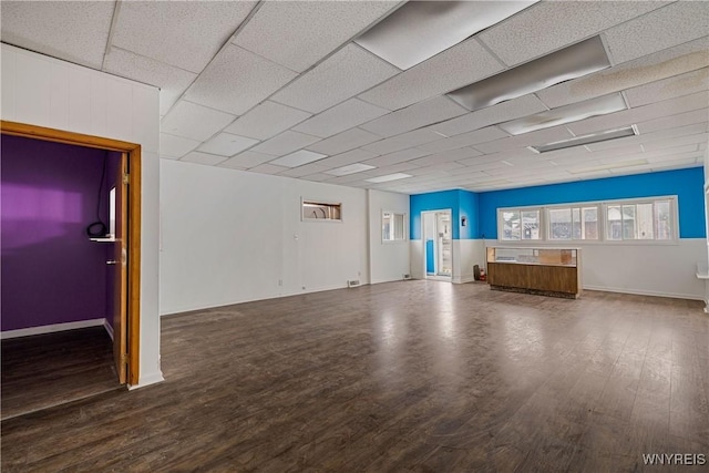 2511 Pine Ave, Niagara Falls, NY 14301 - unfurnished living room with wood finished floors and a drop ceiling